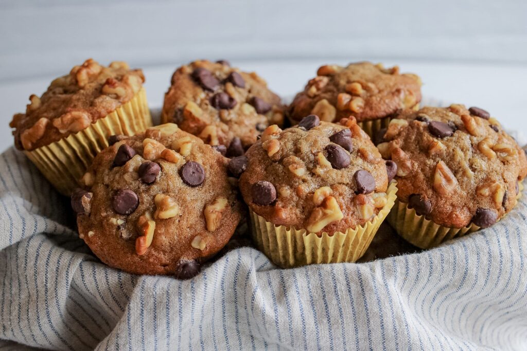 banana chocolate chip muffins in a basket