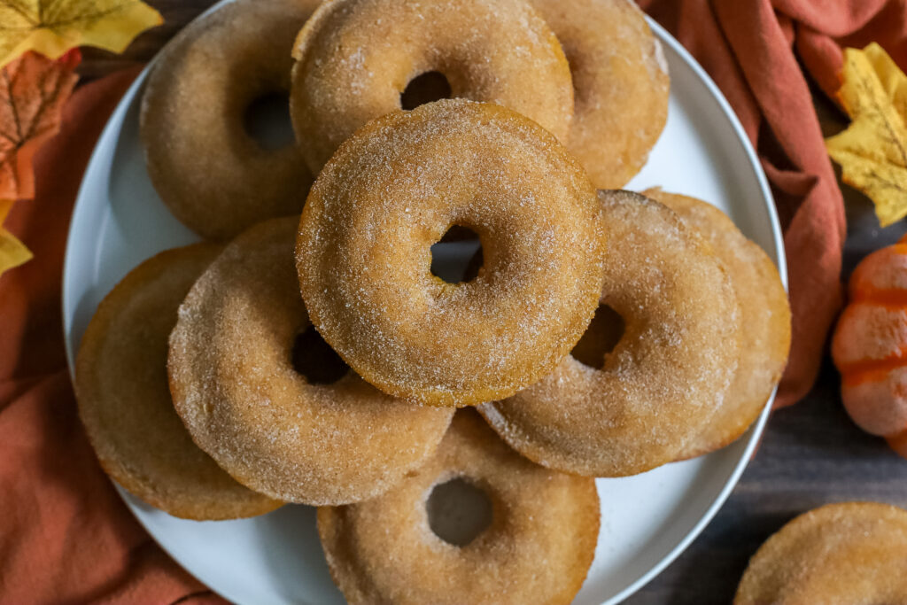 baked pumpkin donuts on a plate