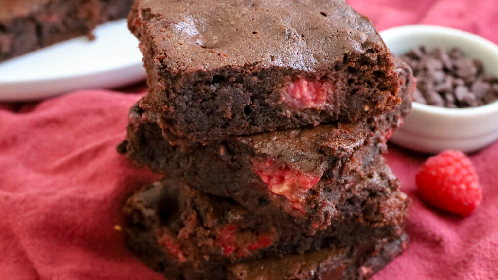 close up of stacked raspberry brownies