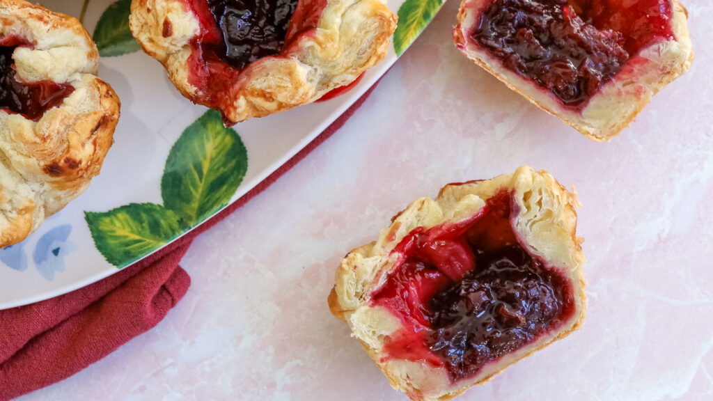 cherry croissants on a table
