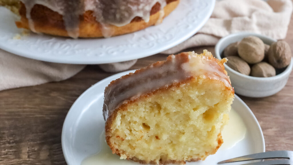 a slice of easy eggnog bundt cake on a plate