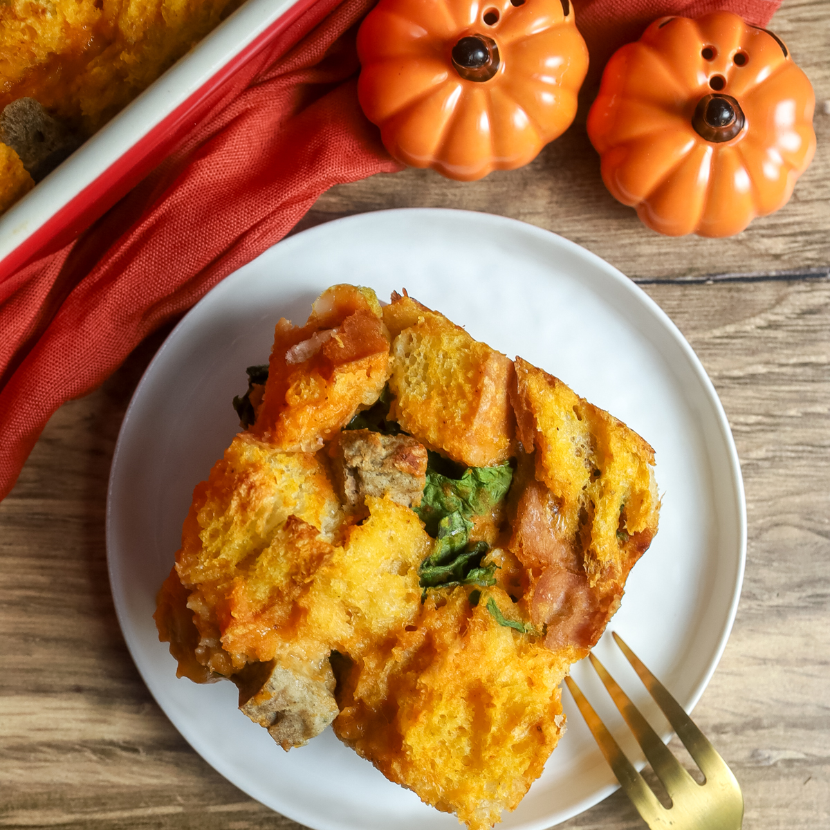 A square of pumpkin breakfast casserole on a plate