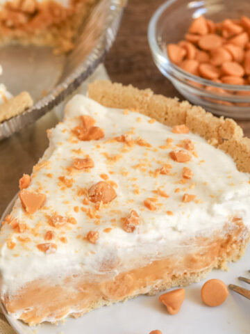 A slice of bourbon butterscotch pie on a plate