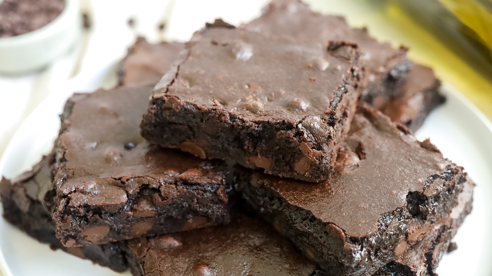 three quarter shot of a plate of dark chocolate brownies brownies