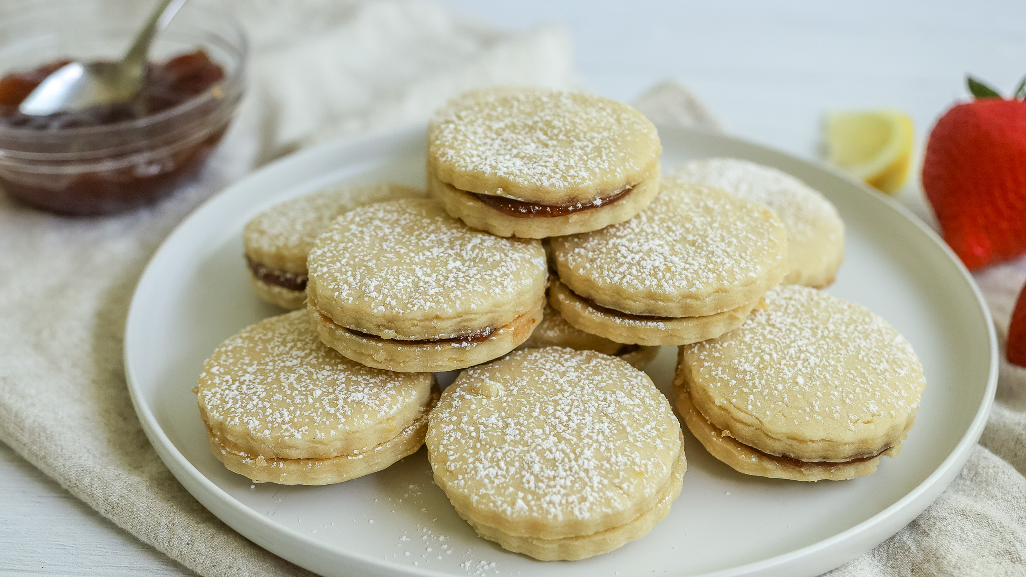 photo of lemon shortbread sandwich cookies on a plate
