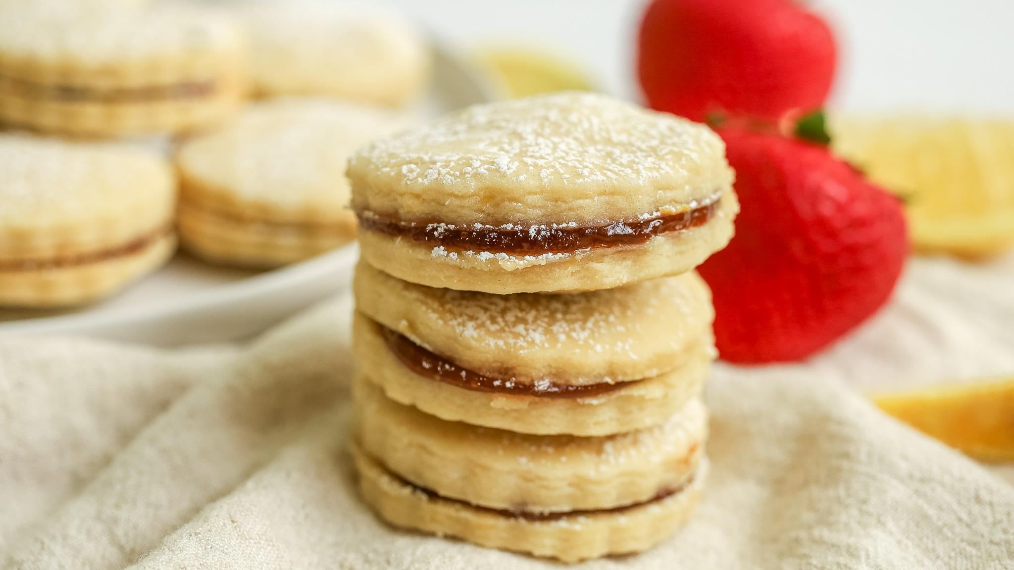 Photo of a stack of lemon shortbread sandwich cookies