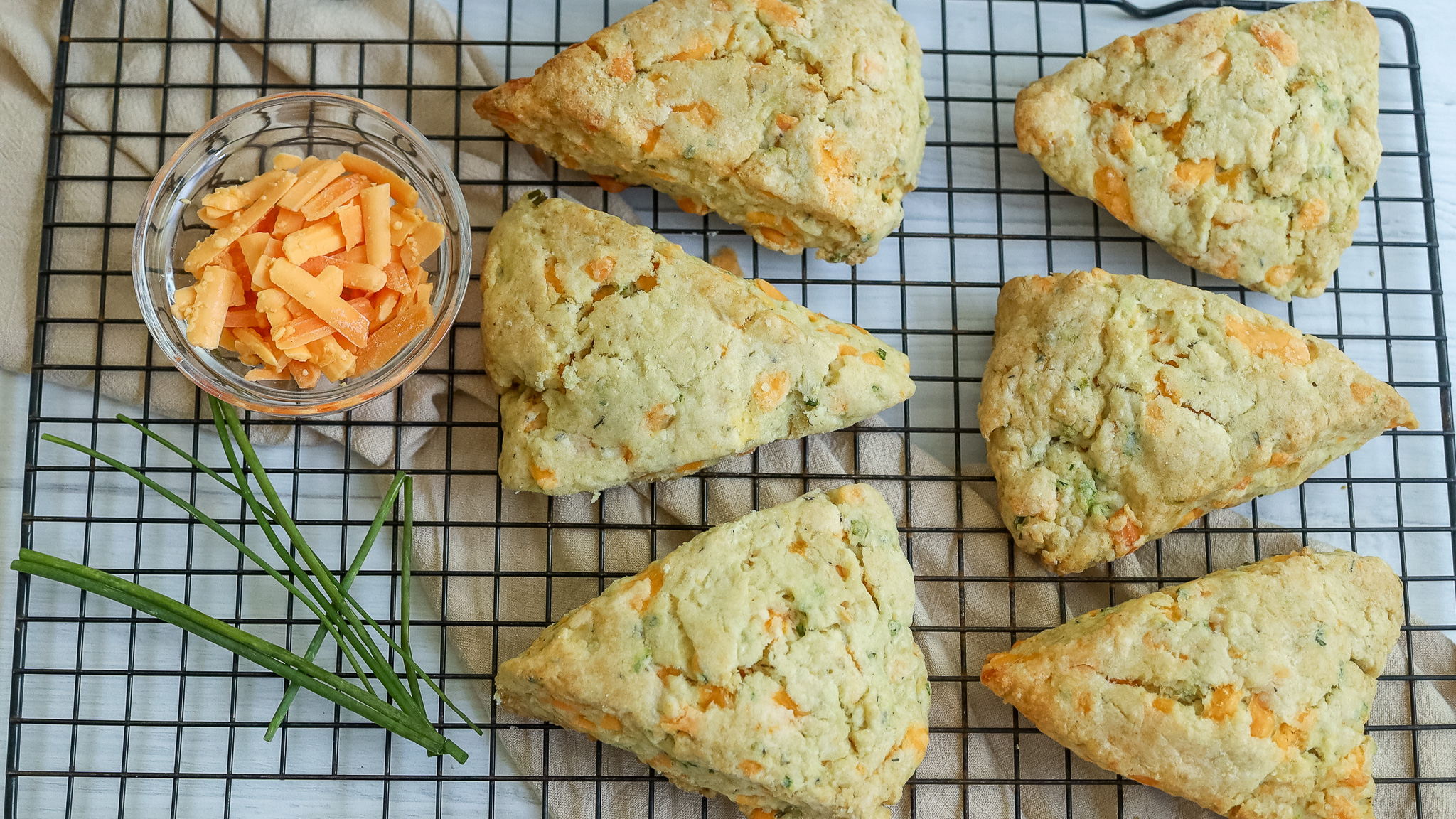 overhead photo of cheddar scones on a cooling rack