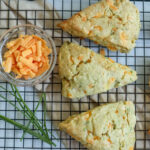Cheddar herb scones on a cooling rack