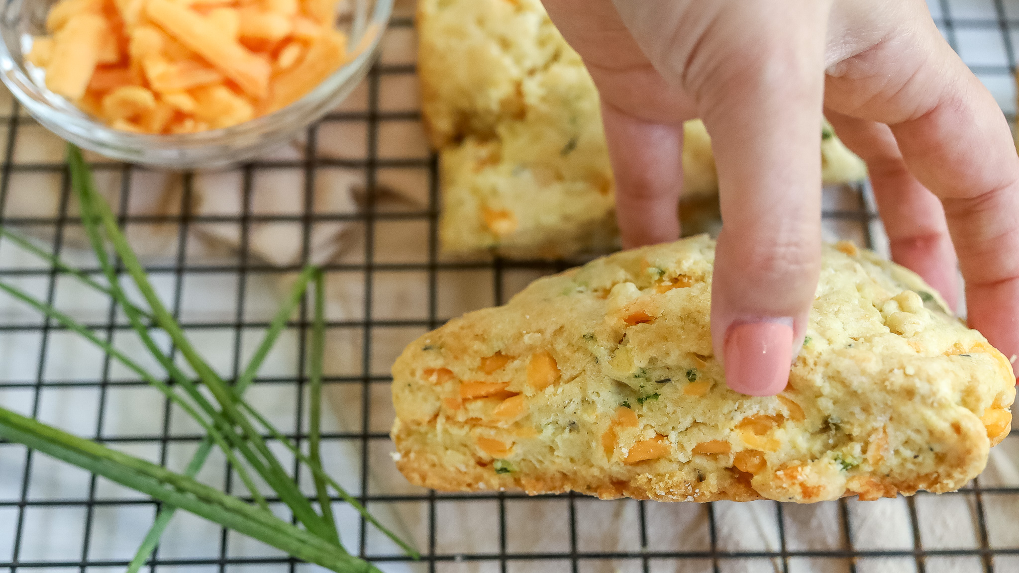 side shot of someone holding a scone