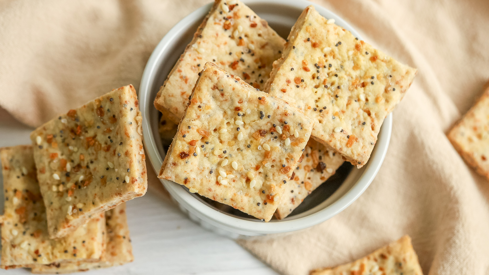 overhead photo of everything bagel crackers in a bowl