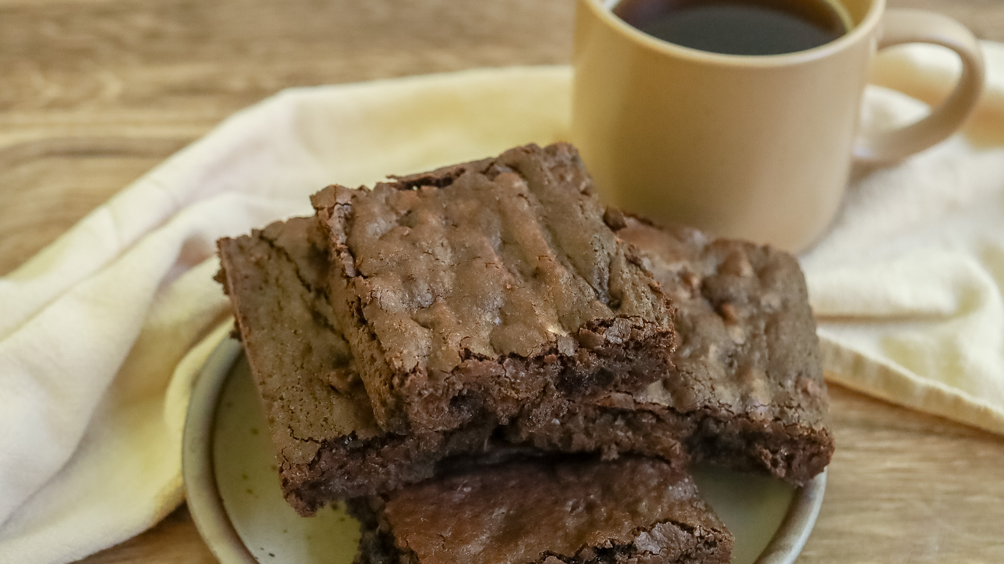 stack of coffee brownies on a table