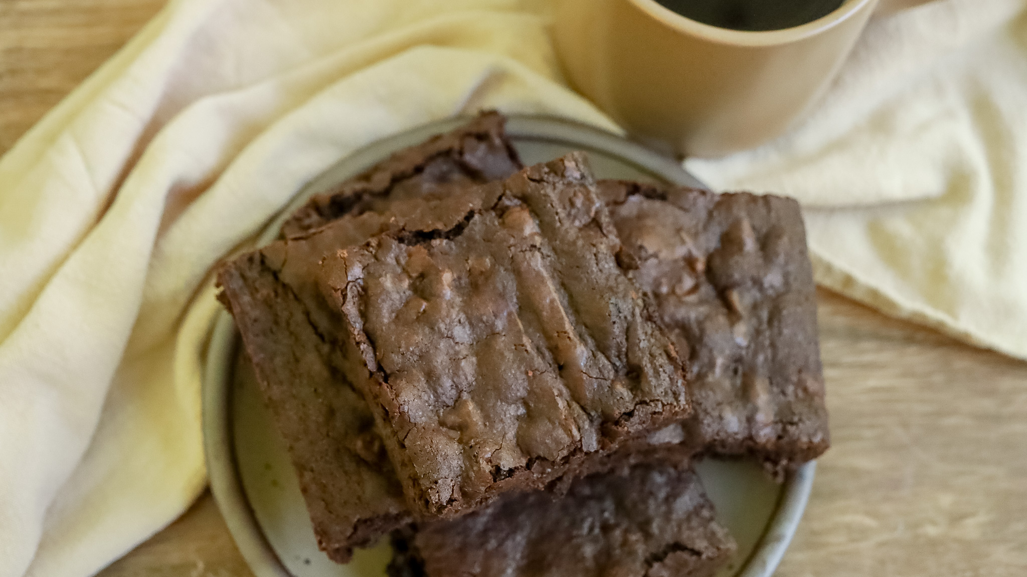 overhead photo of a stack of brownies on a plate
