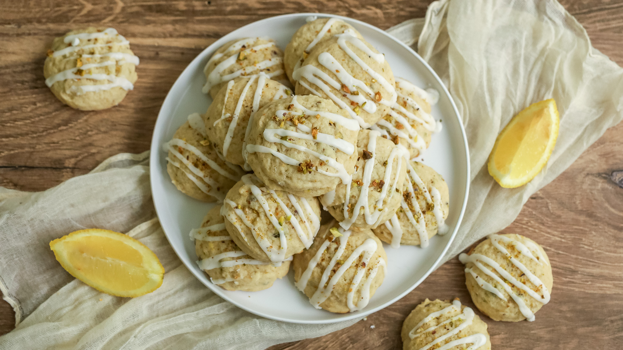 overhead shot of lemon pistachio cookies on a plate