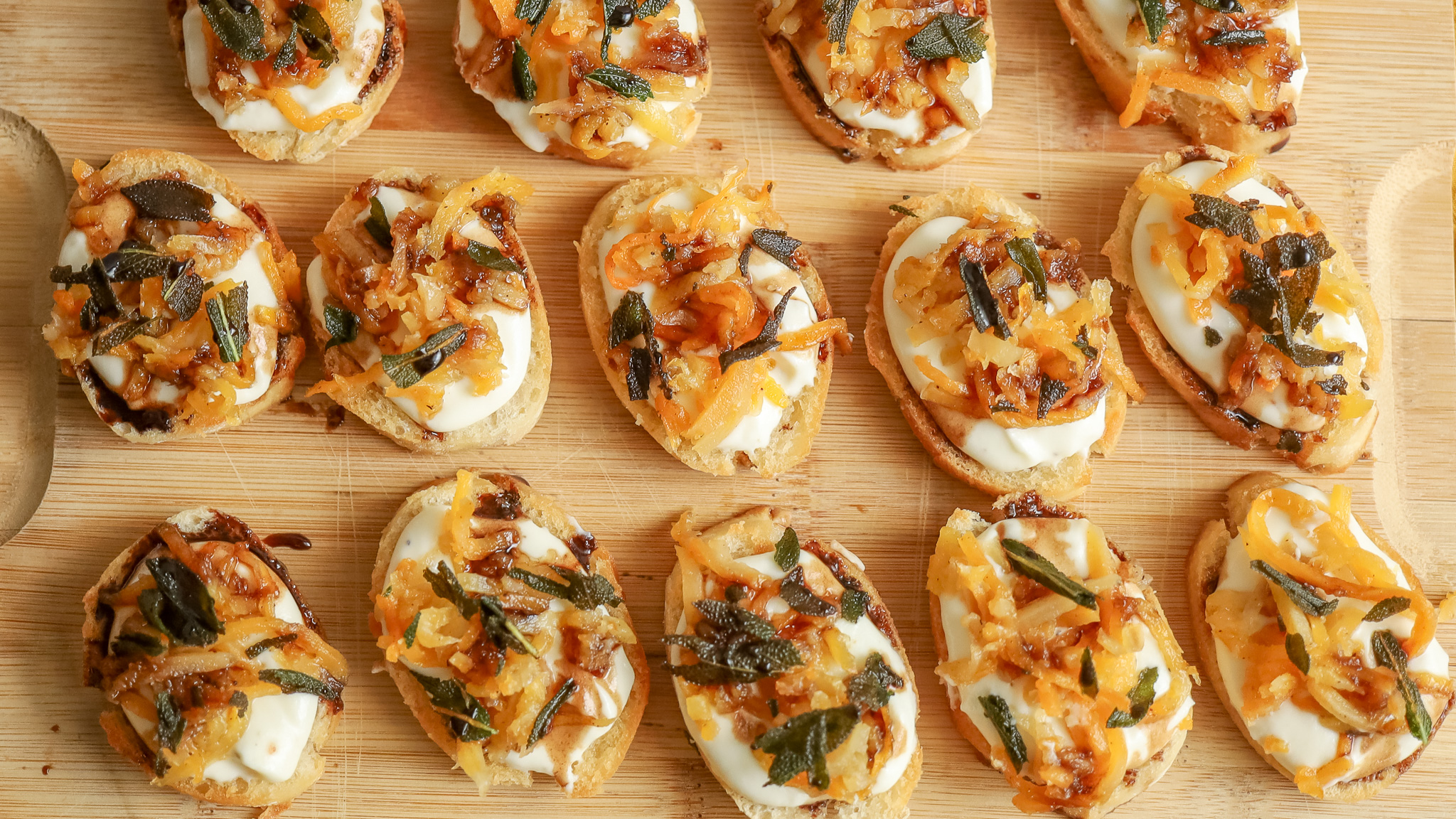 butternut squash and sage crostini on a wooden board